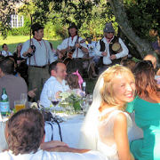 A happy bride as The Mangledwurzels perform at her wedding reception, Batcombe (3 Sept 2005)